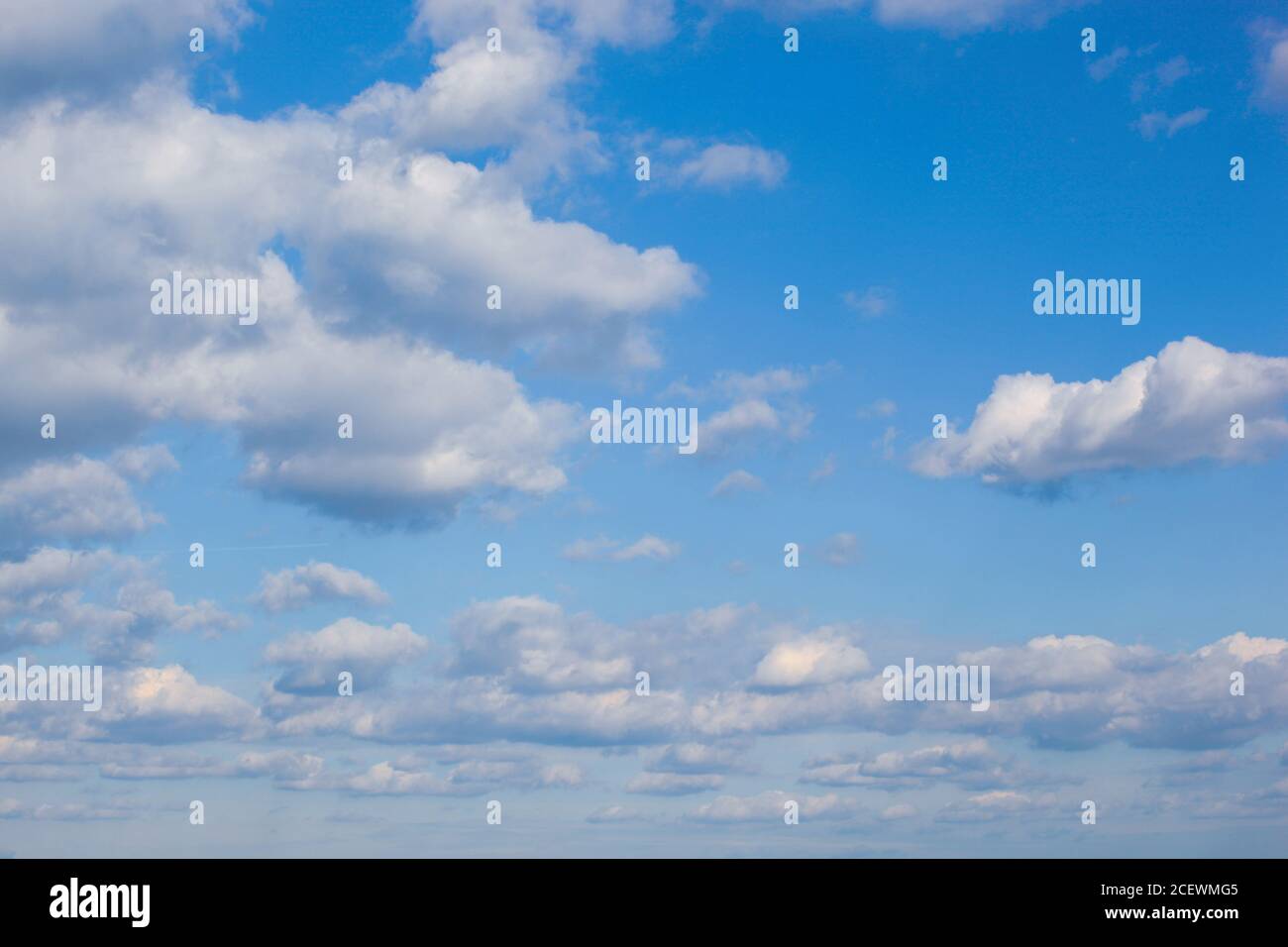 Low angle shot of clouds in the blue sky Stock Photo - Alamy