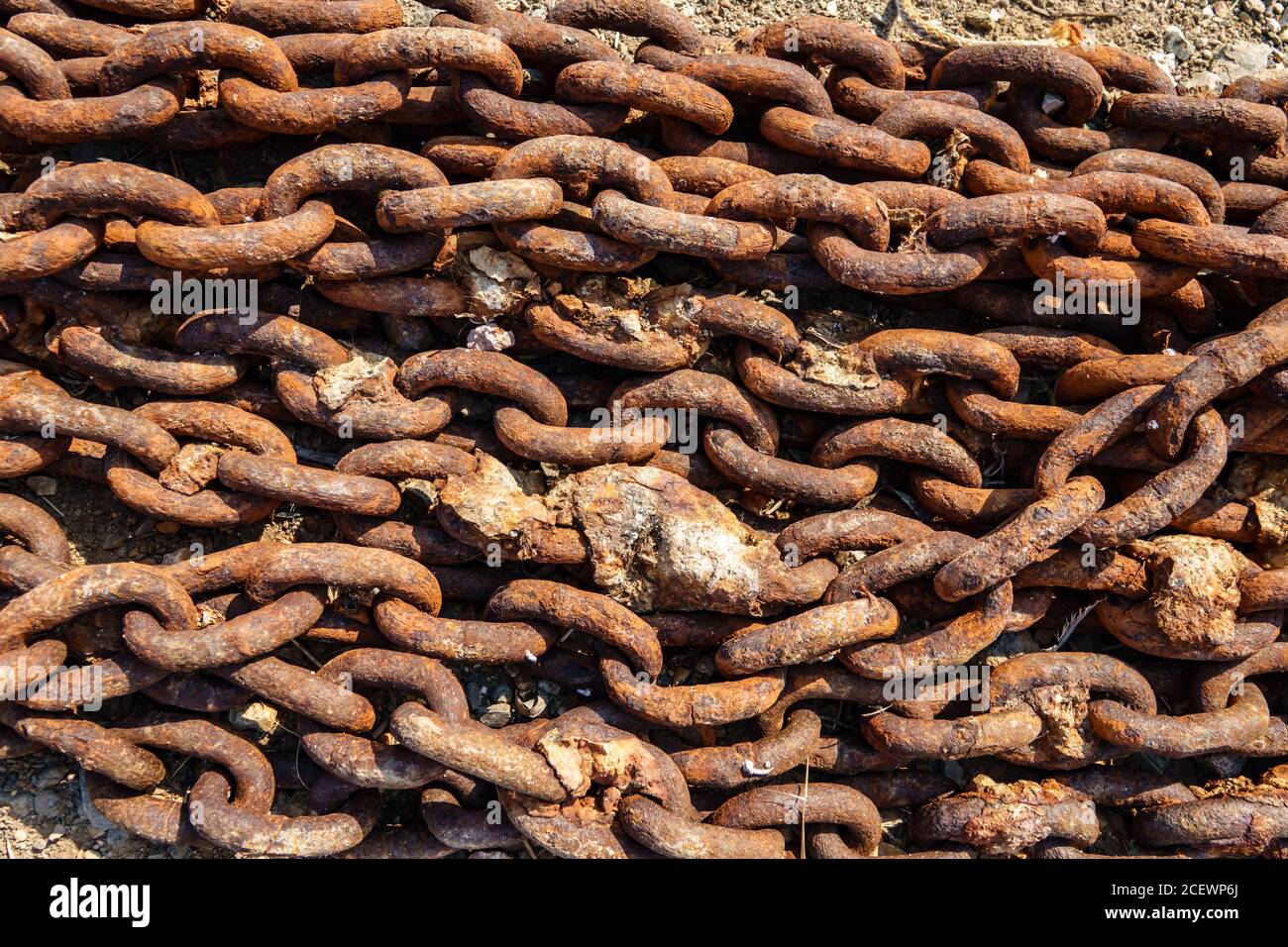Old metal rusty anchor chain on sunset Stock Photo