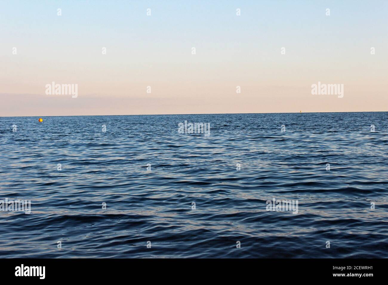 Beautiful deep blue Irish Sea at sunset from Pwllheli beach, North Wales Stock Photo