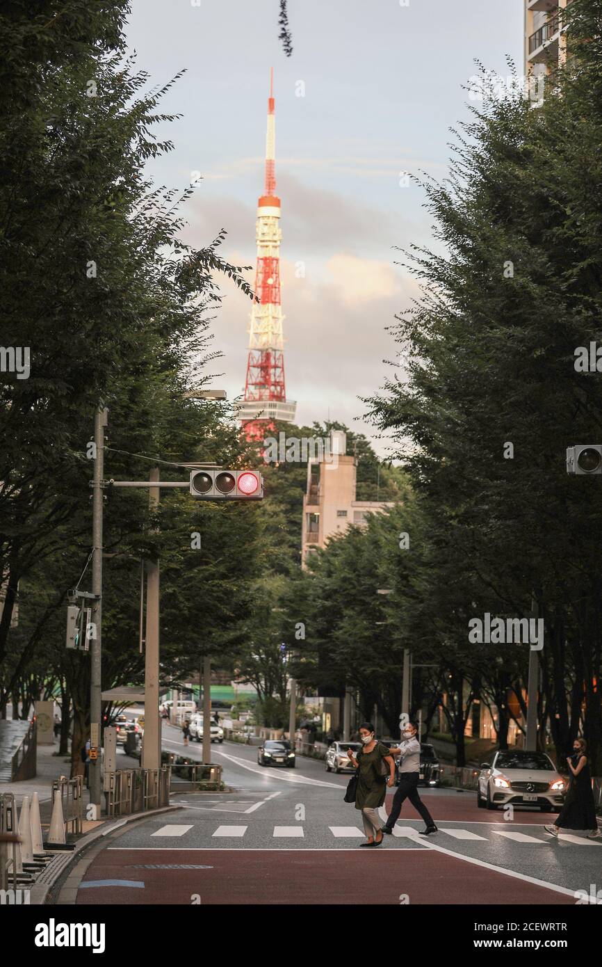 Tokyo, Japan. 2nd Sep, 2020. People wearing face masks walk on the street in Tokyo, Japan, on Sept. 2, 2020. Japan on Wednesday reported 592 new coronavirus cases, dropping from 633 new infections confirmed the previous day and bringing the nation's cumulative COVID-19 tally to 69,743, not including those related to a cruise ship quarantined in Yokohama near Tokyo earlier in the year. Credit: Du Xiaoyi/Xinhua/Alamy Live News Stock Photo