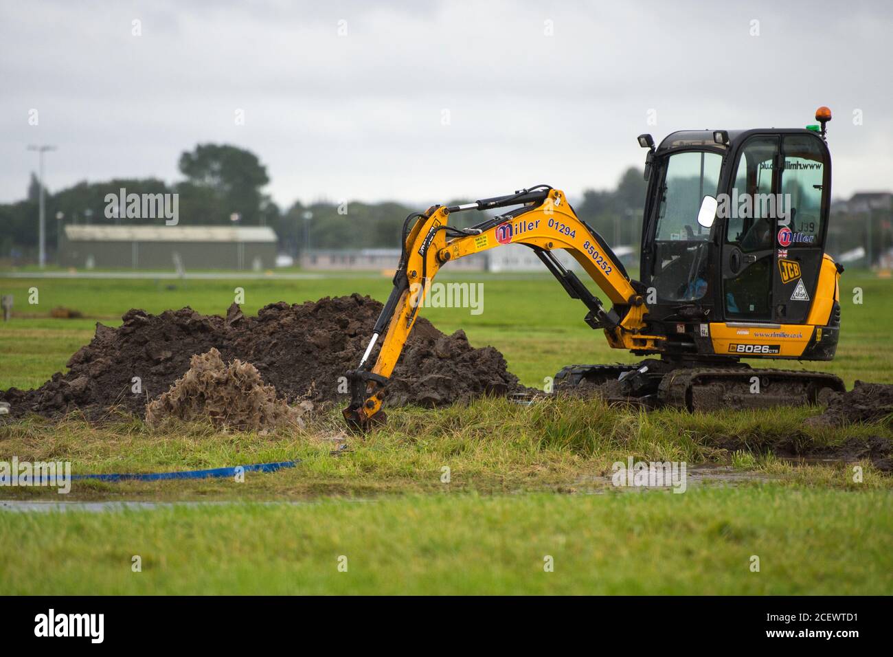 Glasgow, Scotland, UK. 2nd Sep, 2020. Pictured: A burst water mains pipe gushes water with some force flooding the surrounding airside area inside the perimeter security fence of Glasgow Airport. There is currently nobody at the burst water mains pipe, however Police have been alerted. Credit: Colin Fisher/Alamy Live News Stock Photo