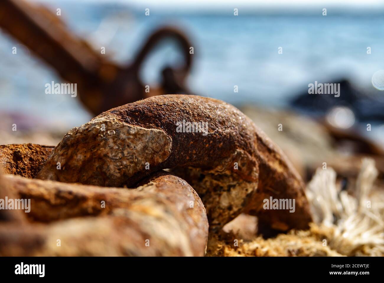 Old metal rusty anchor chain on sunset Stock Photo
