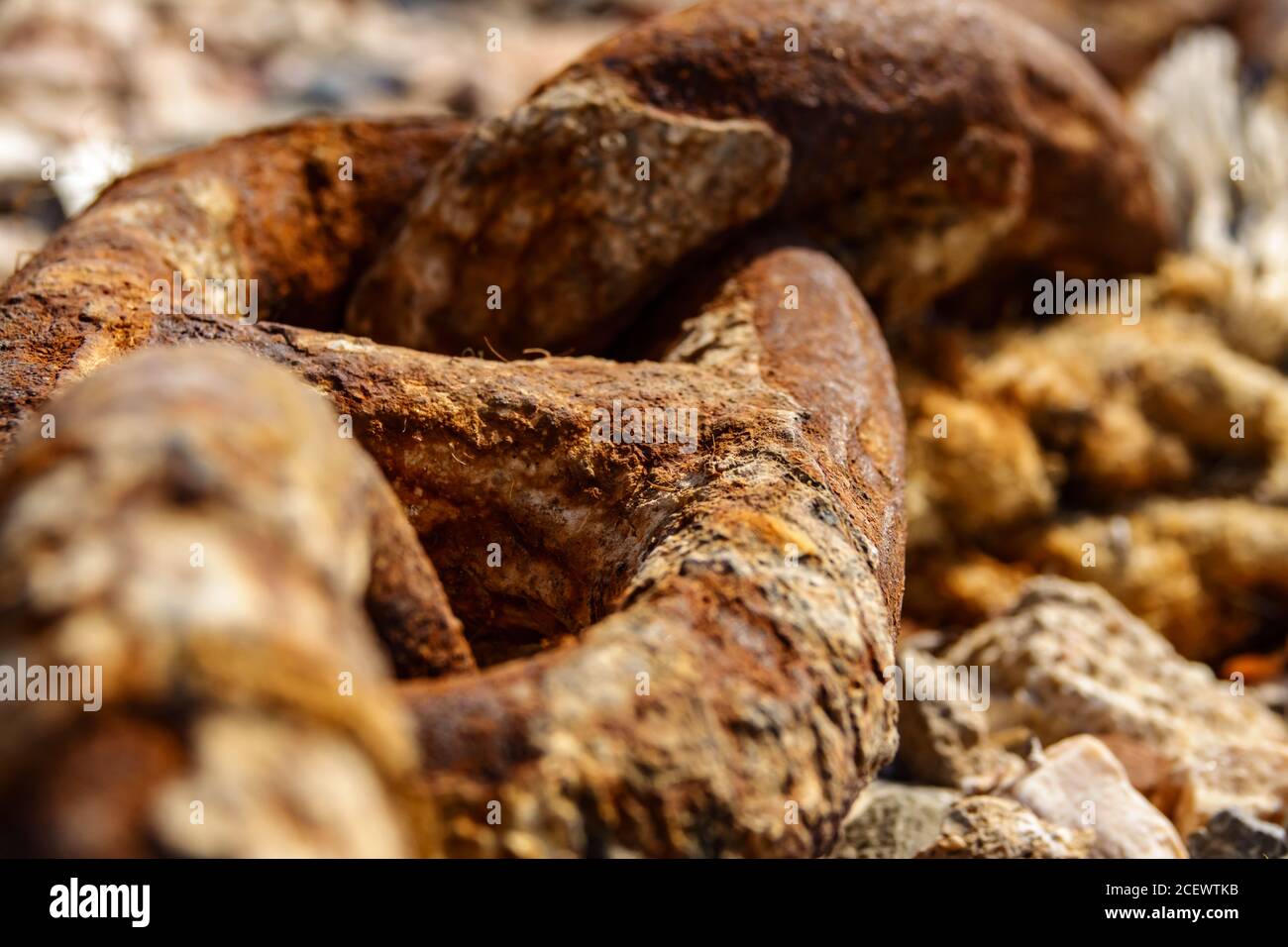 Old metal rusty anchor chain on sunset Stock Photo
