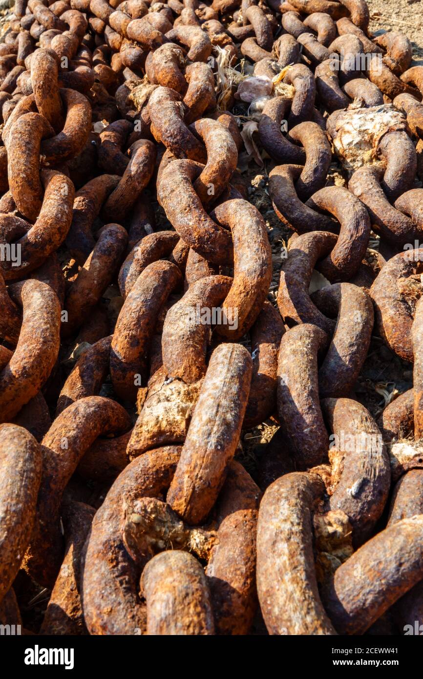 Old metal rusty anchor chain on sunset Stock Photo