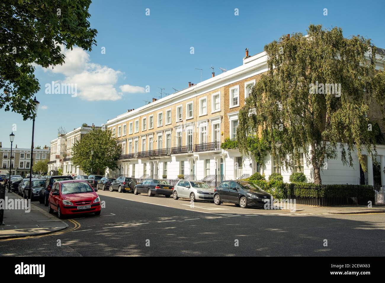 Typical street of beautiful white stucco terraced townhouses in Chelsea Stock Photo