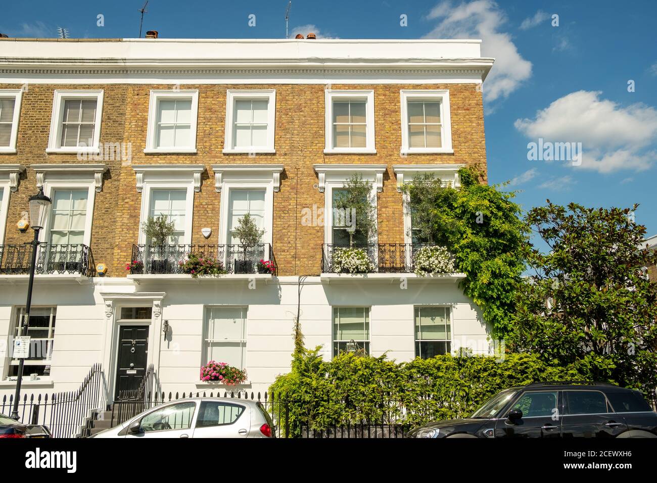 Typical street of beautiful white stucco terraced townhouses in Chelsea Stock Photo