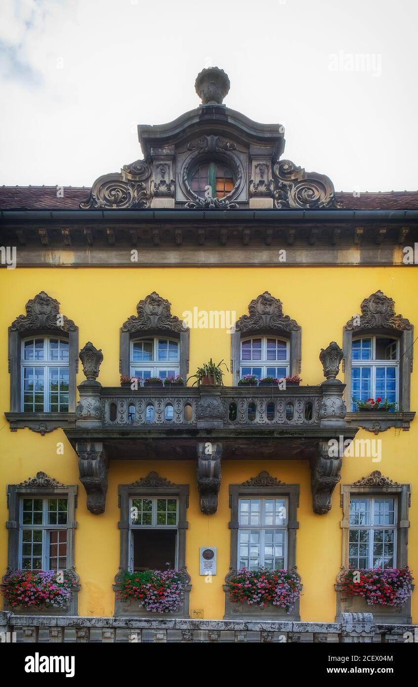 Budapest, Hungary, Aug 2019, view of the upper part of a yellow colour building with a balcony Stock Photo