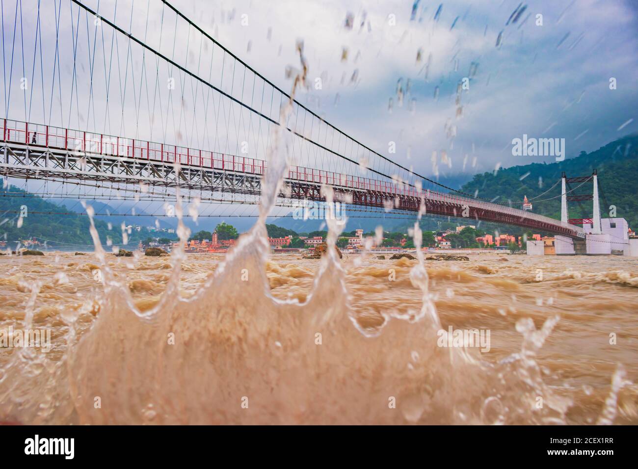 view of River Ganges, the famous bridge Janki Bridge during monsoon in Rishikesh, India Stock Photo
