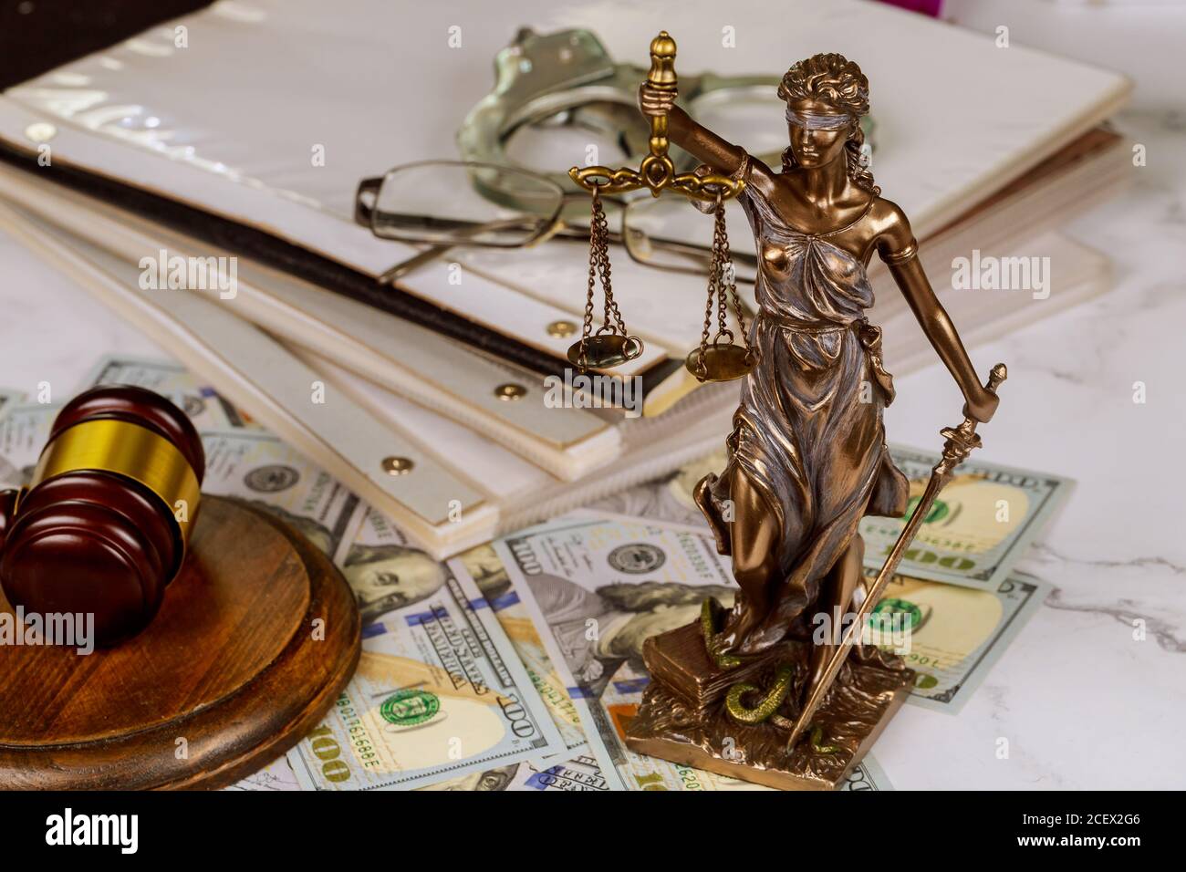 Legislation office statue of justice symbol on workplace law document with Judge's gavel police handcuffs Stock Photo