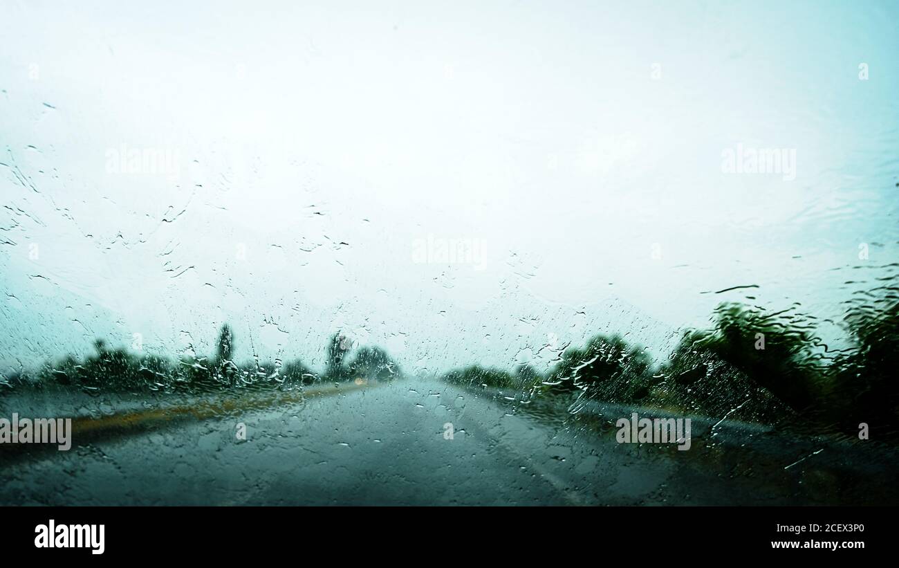View through the car window in the rain. Rainy weather through the car