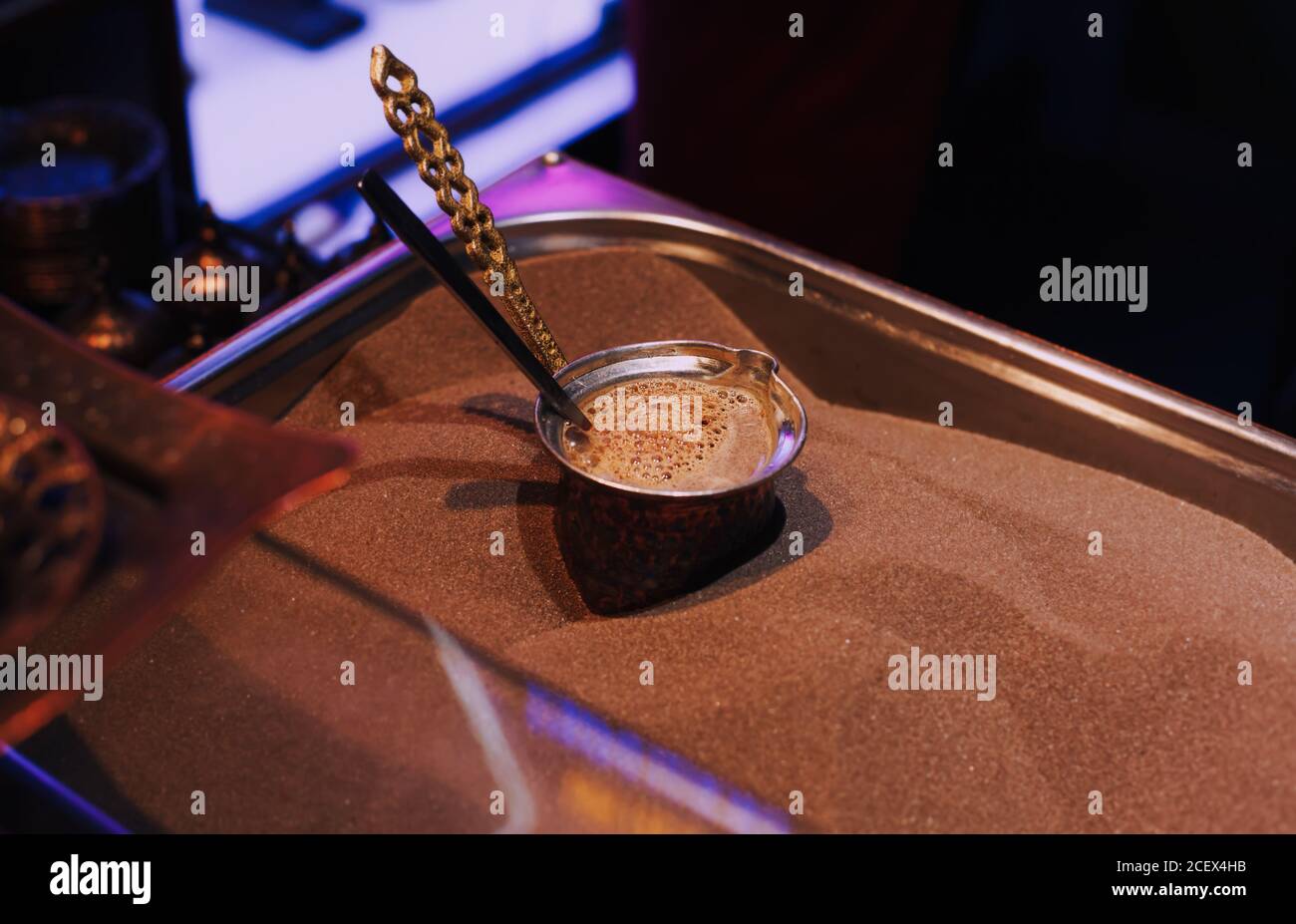 Making coffee on the sand close up, turkish coffee on a market