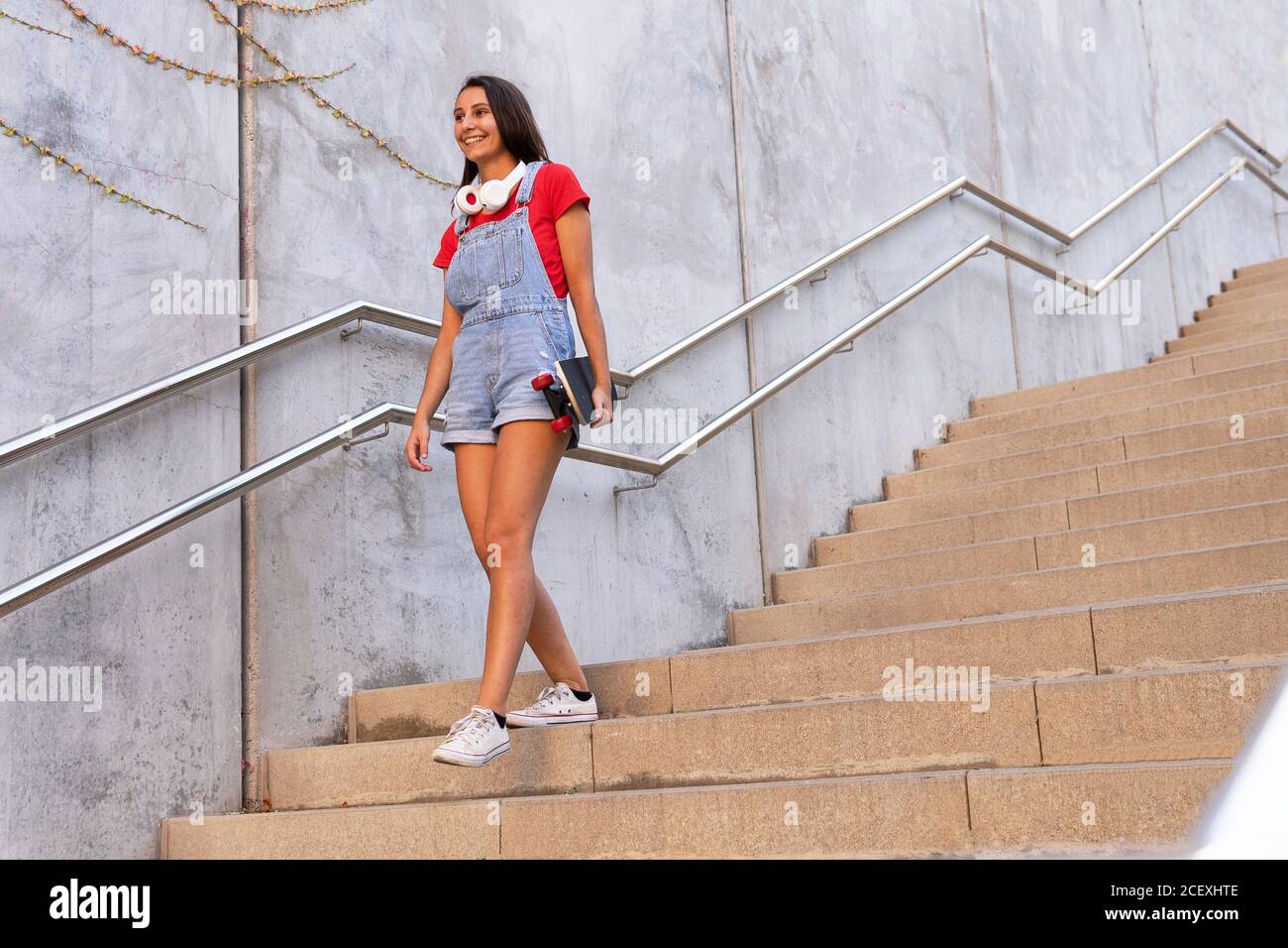 Urban woman in denim overalls hi-res stock photography and images - Alamy