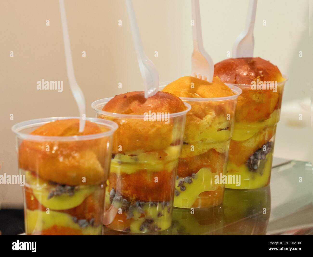 rum baba, traditional Neapolitan dessert with lemon liqueur cream