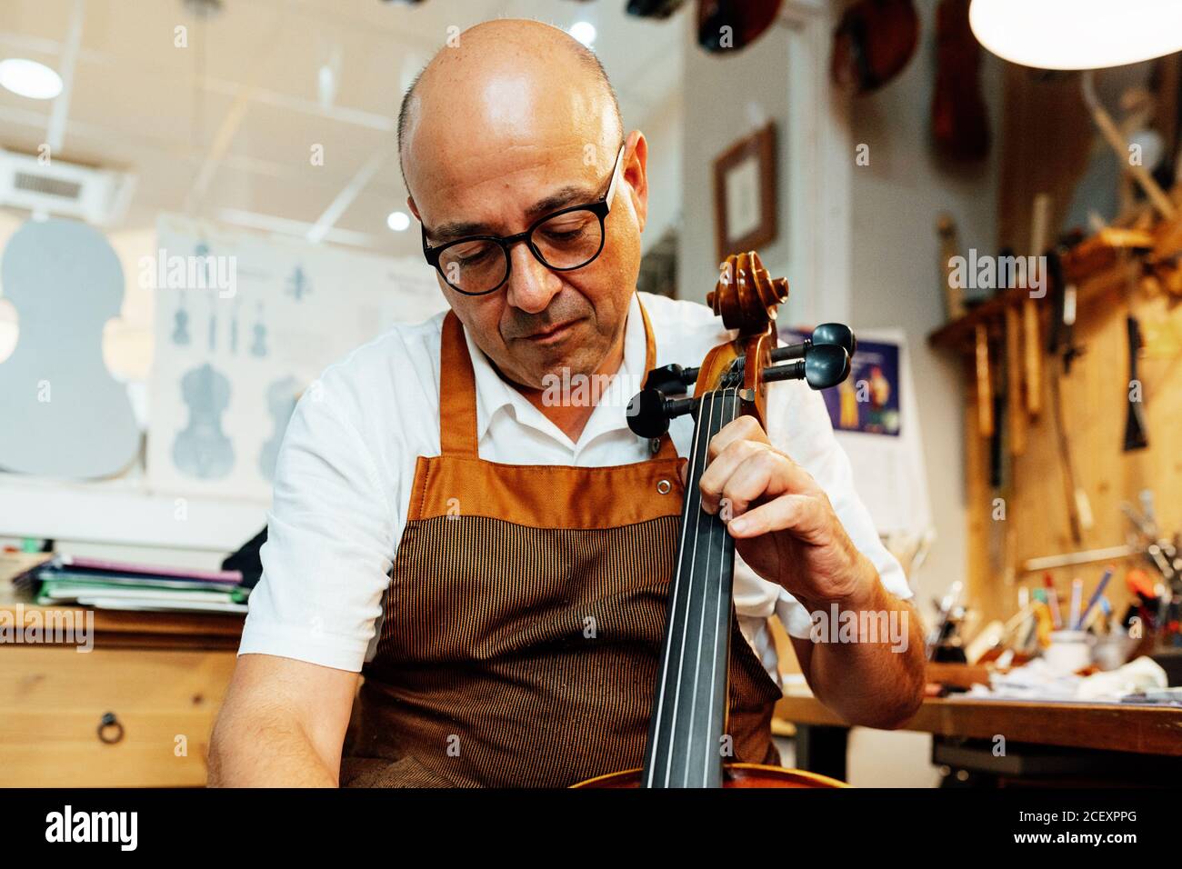 Luthier Instrument Master artisan luthier working on hi-res stock photography and images ...