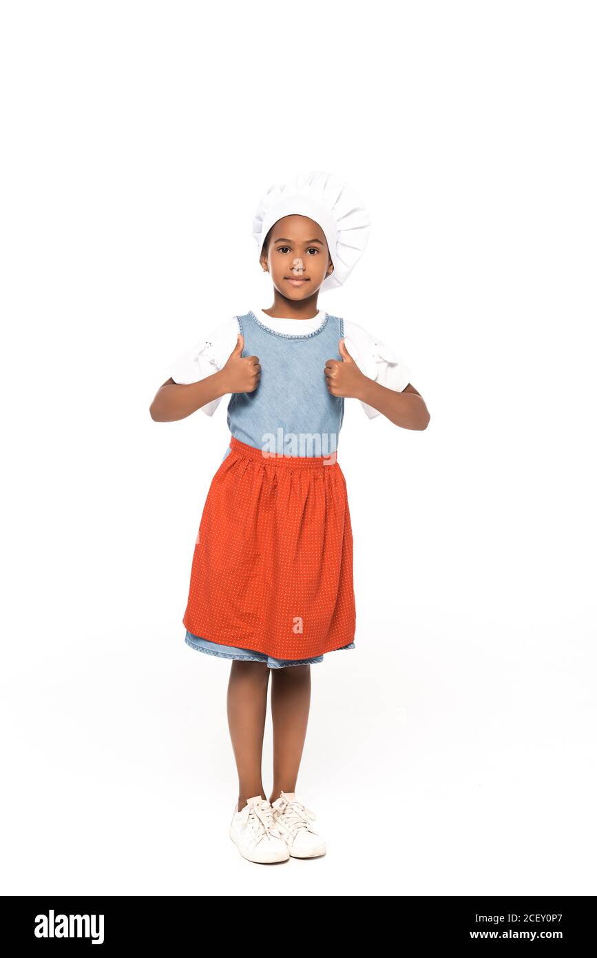 African american kid dressed in costume of chef showing thumbs up