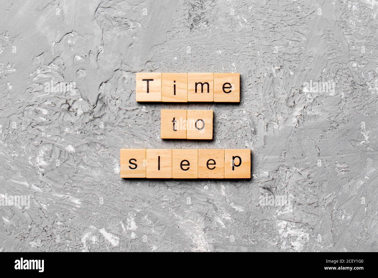 time to sleep word written on wood block. time to sleep text on cement ...