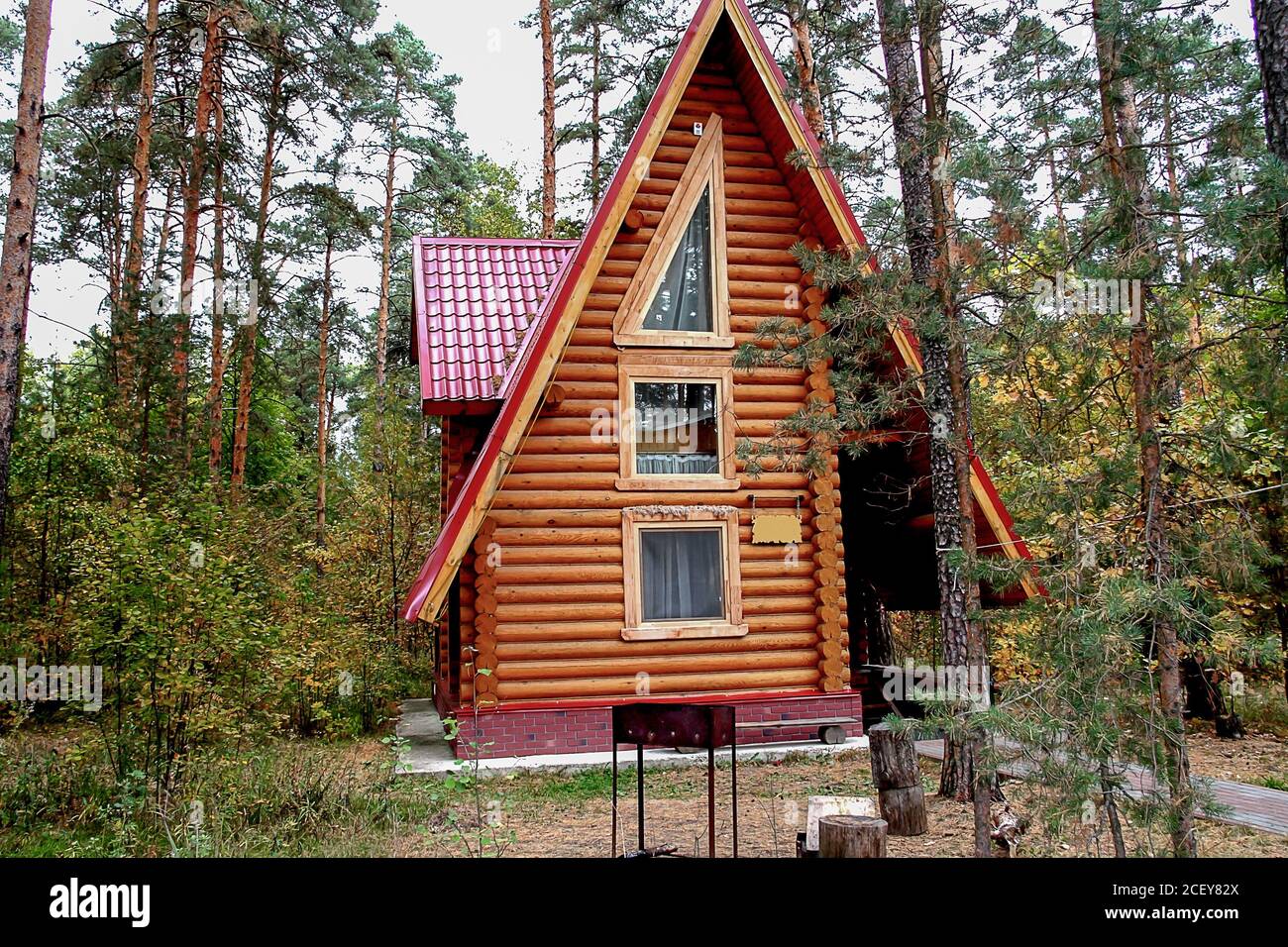 Modern log house in a forest environment, wooden vacation home Stock ...