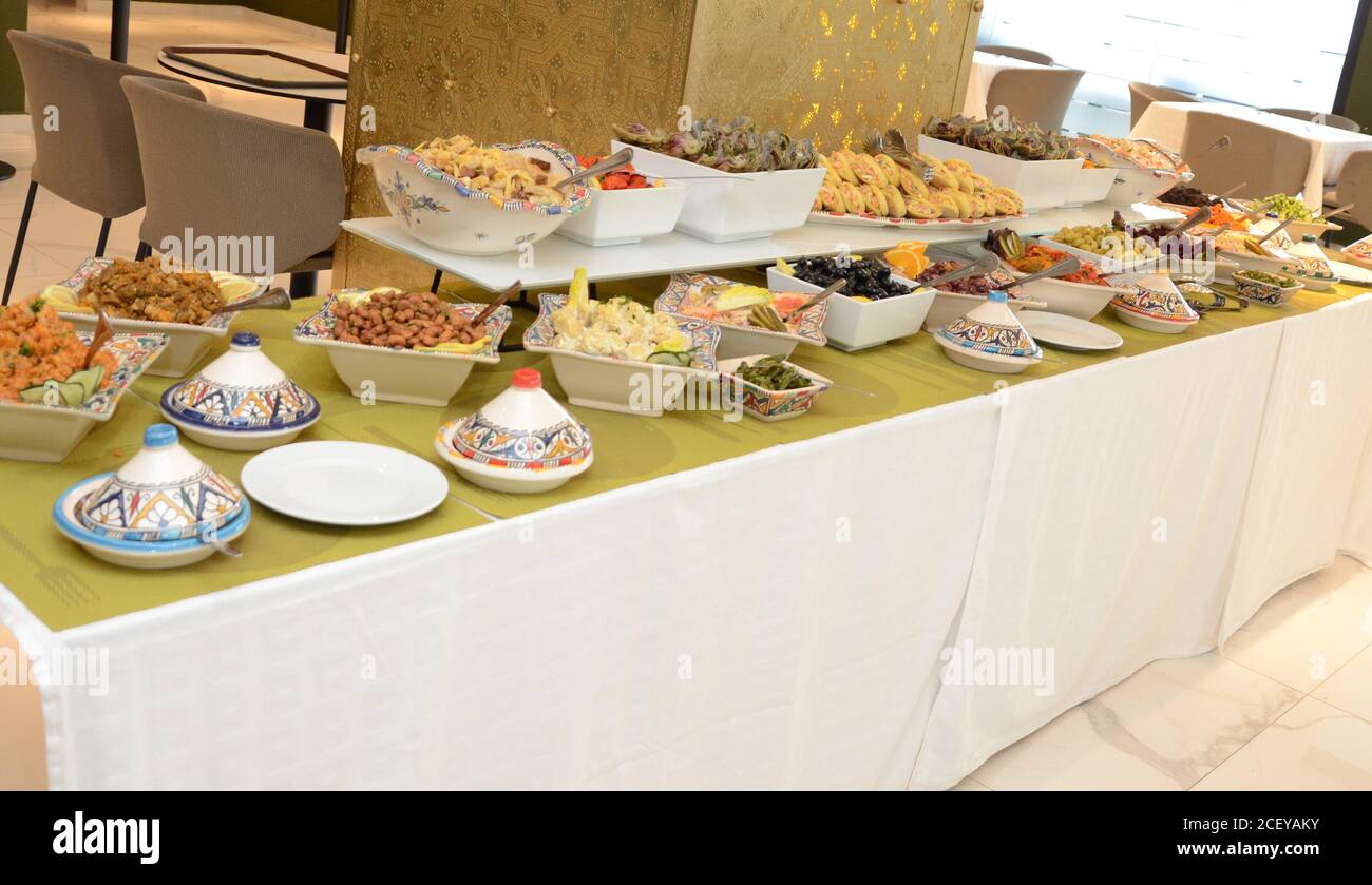 Moroccan buffet, traditional Moroccan food, tagine, chebakia, and Arabic  sweets Stock Photo - Alamy