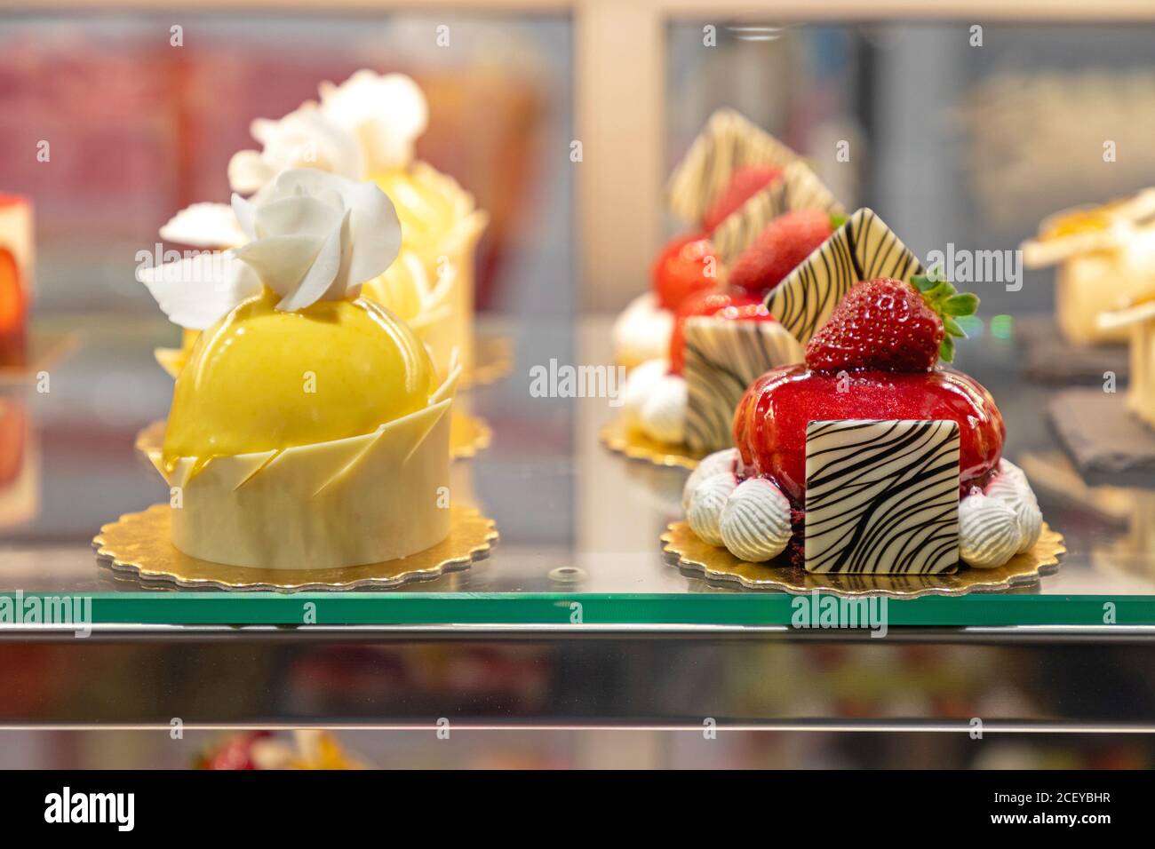 Assortment of Culinary Art Cakes in Patisserie Display Stock Photo