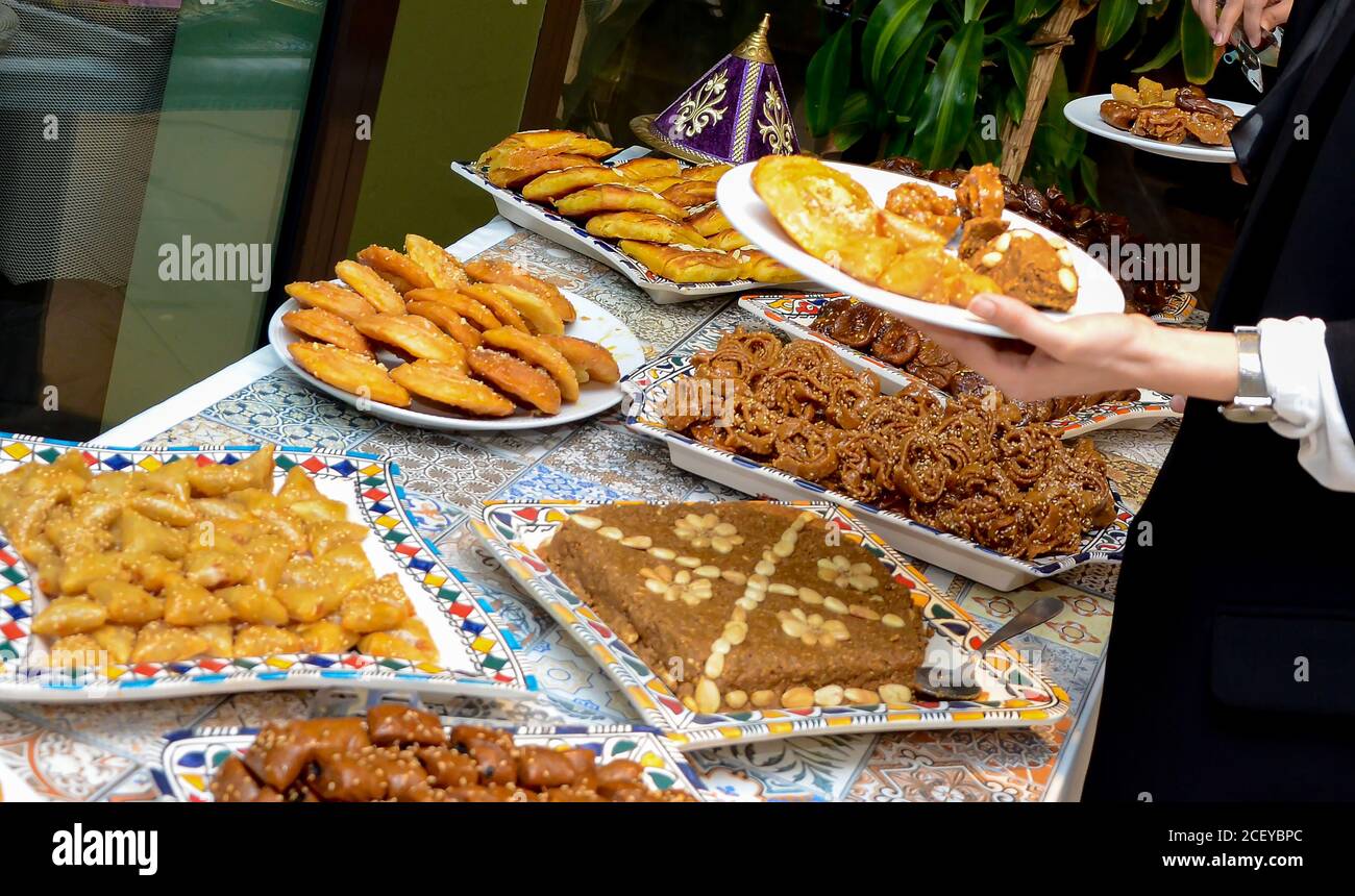Moroccan buffet, traditional Moroccan food, tagine, chebakia, and Arabic sweets. Stock Photo