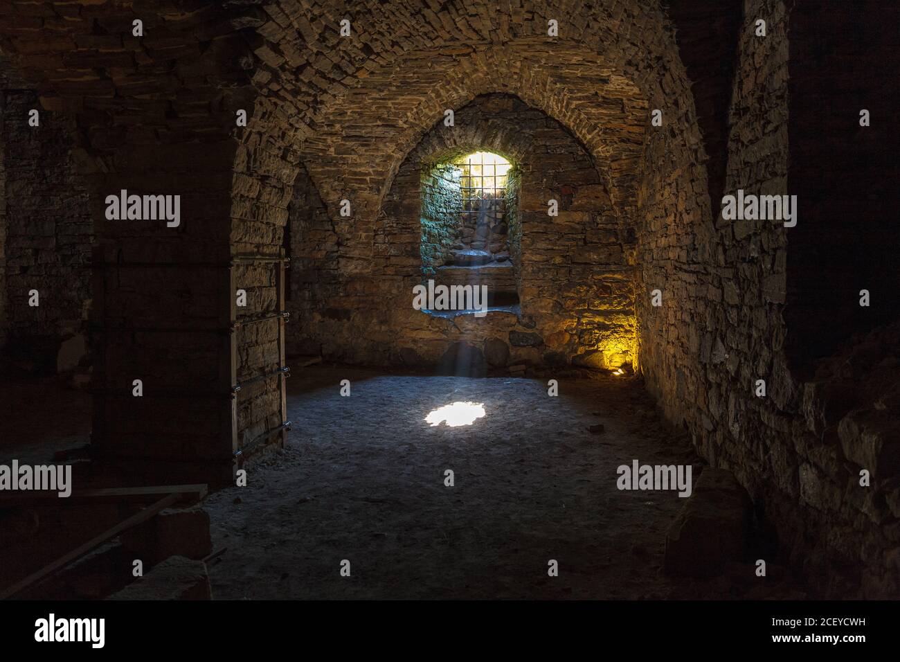Rays of light shining into the medieval cellar Stock Photo - Alamy