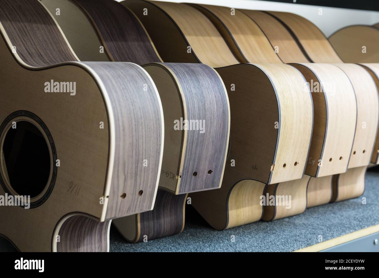 Partially finished guitar bodies in the assembly line at the Taylor