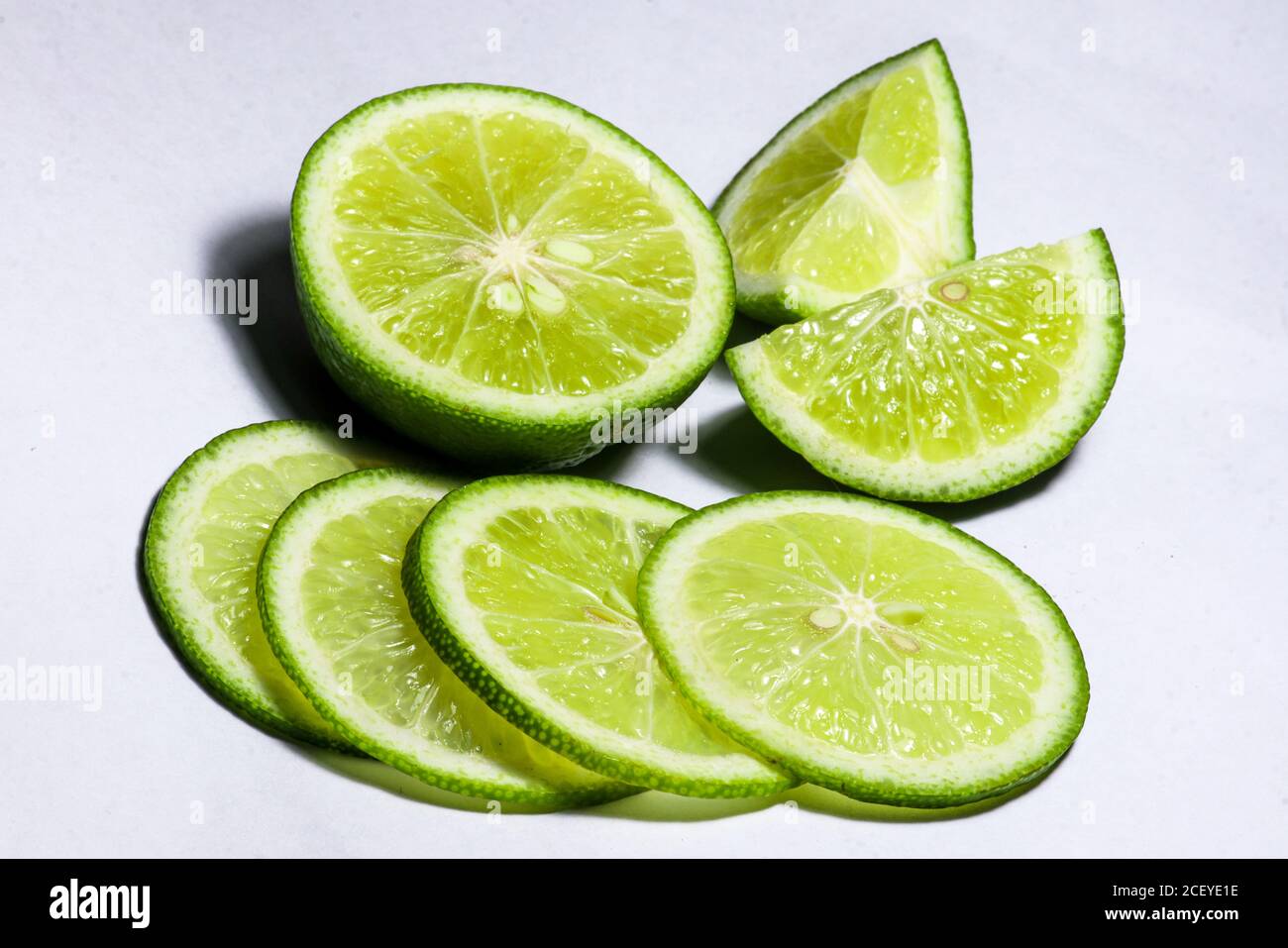 Green lime wedge on white background Stock Photo