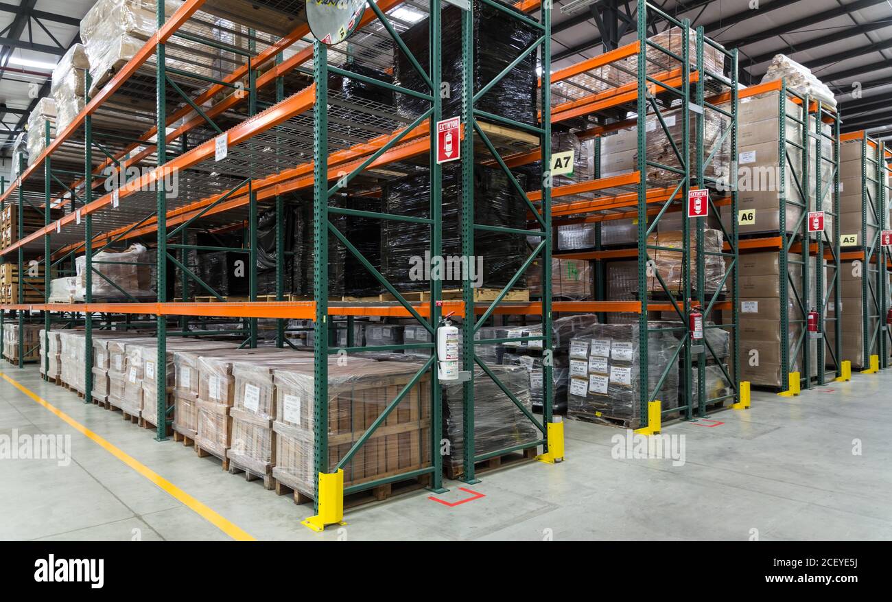 Exotic woods are stacked while awaiting assembly to make guitars in the