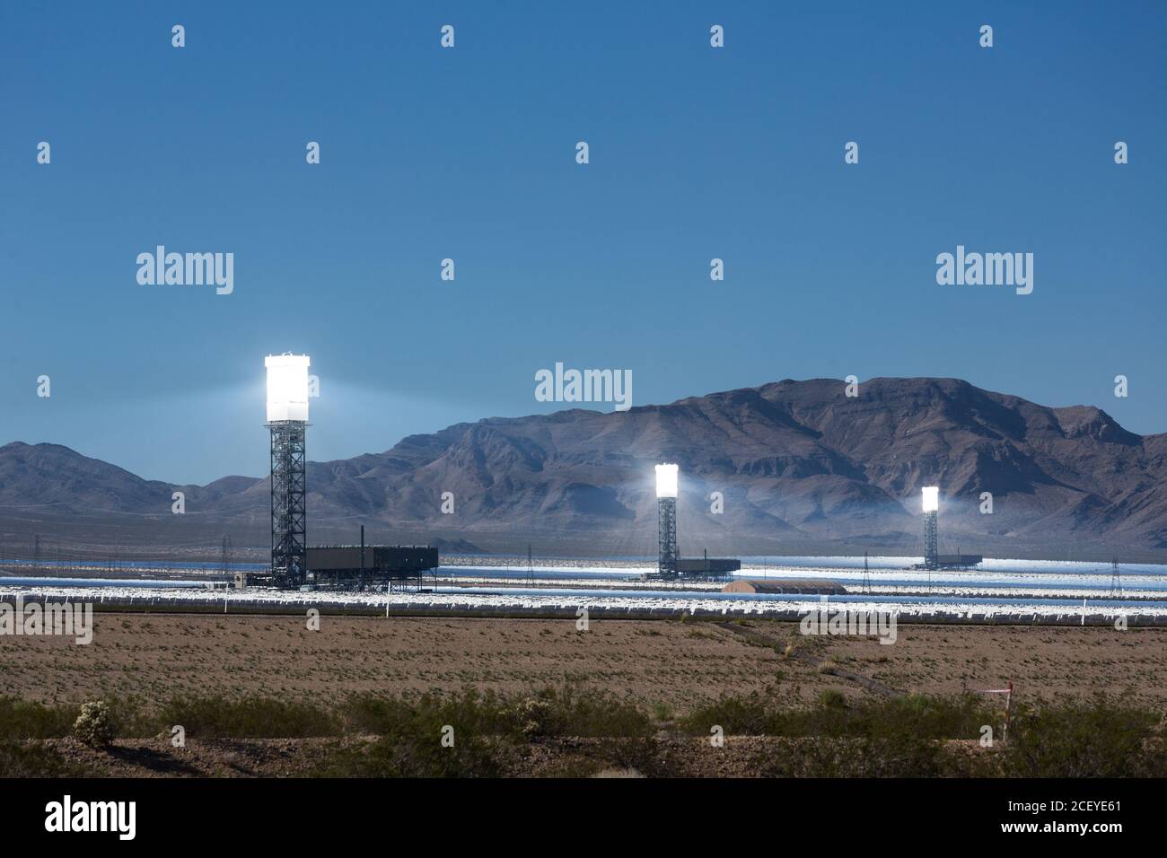 The Ivanpah Solar Power Facility, a concentrated solar thermal plant  in the Mojave Desert near Ivanpah, California and Primm, Nevada, is one of the l Stock Photo
