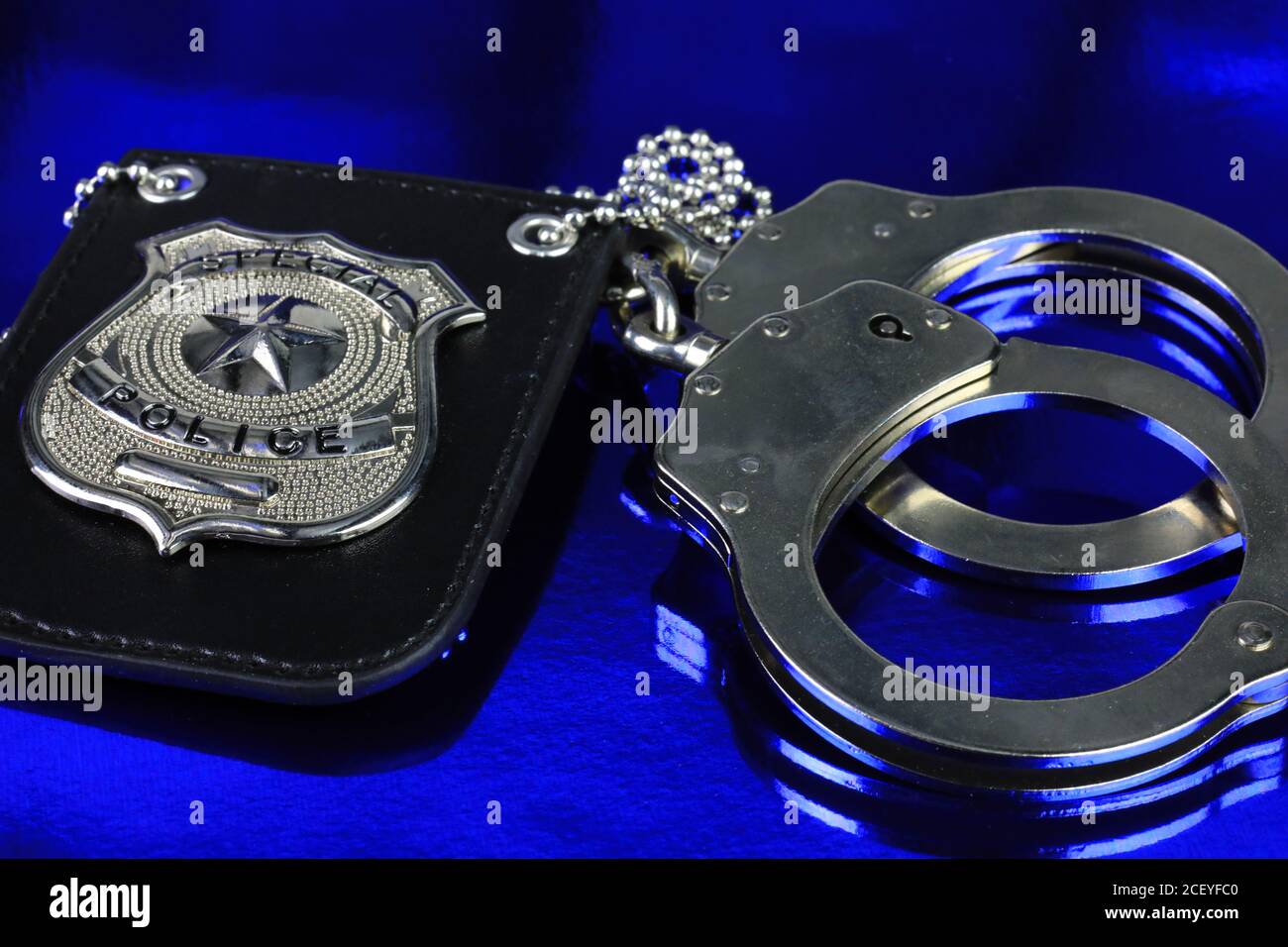 Law enforcer concept with police badge and hand cuffs Stock Photo