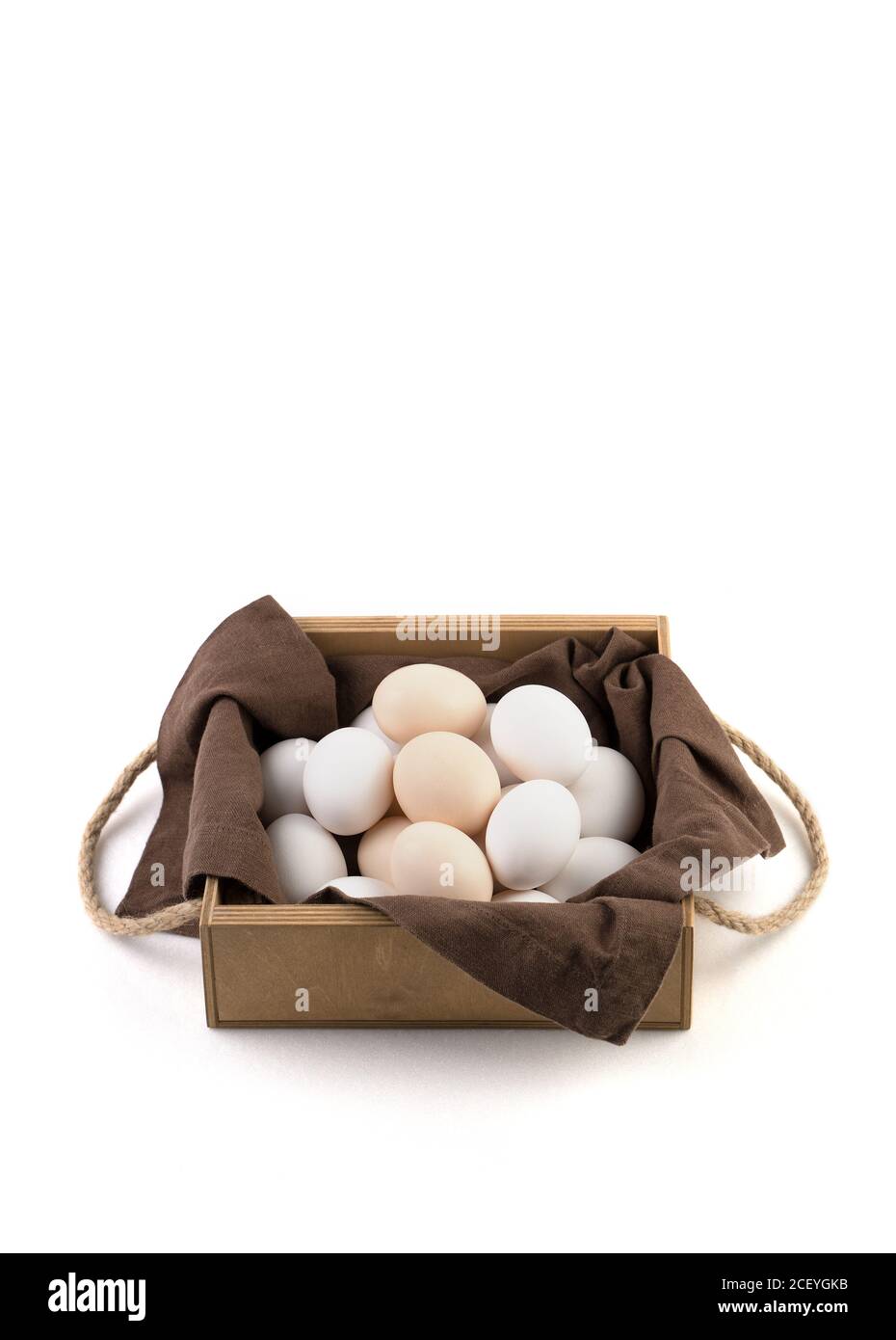 Fresh chicken eggs are placed in a beautiful package on a white ...