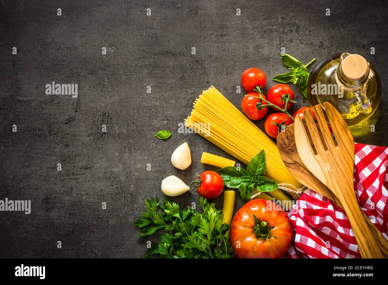 Italian food background on black table Stock Photo - Alamy