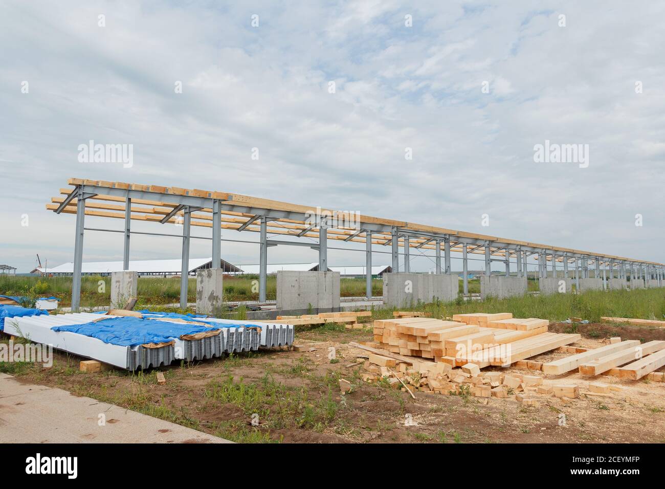 Roof construction from timber beams and steel frames. Agricultural