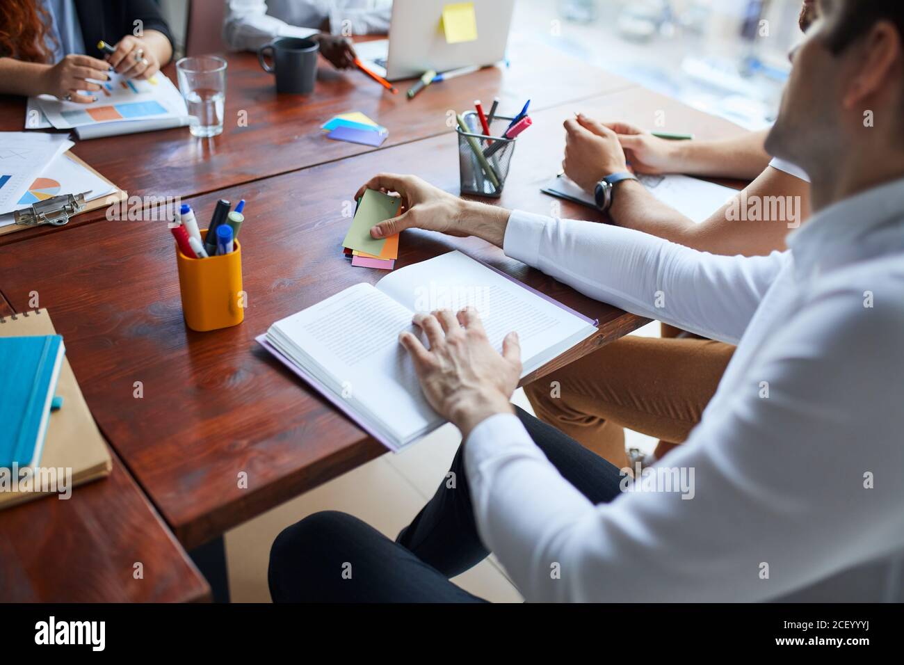 Team work process in modern office using papers. Analyze plans for future business strategy Stock Photo