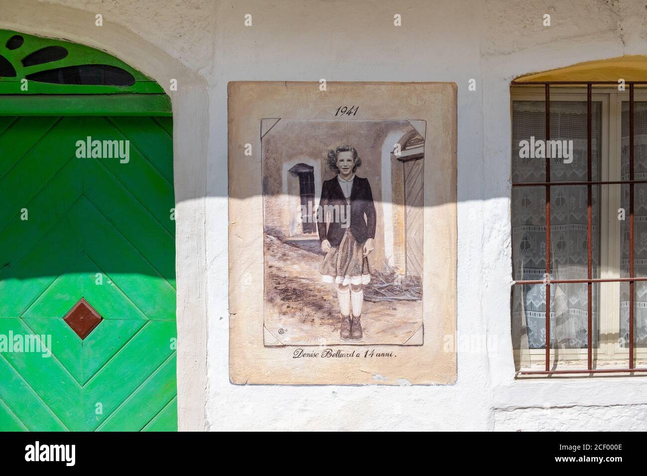 Painted mural of a resident in 1941 of the small village of Usseaux, Piemonte,Italy Stock Photo