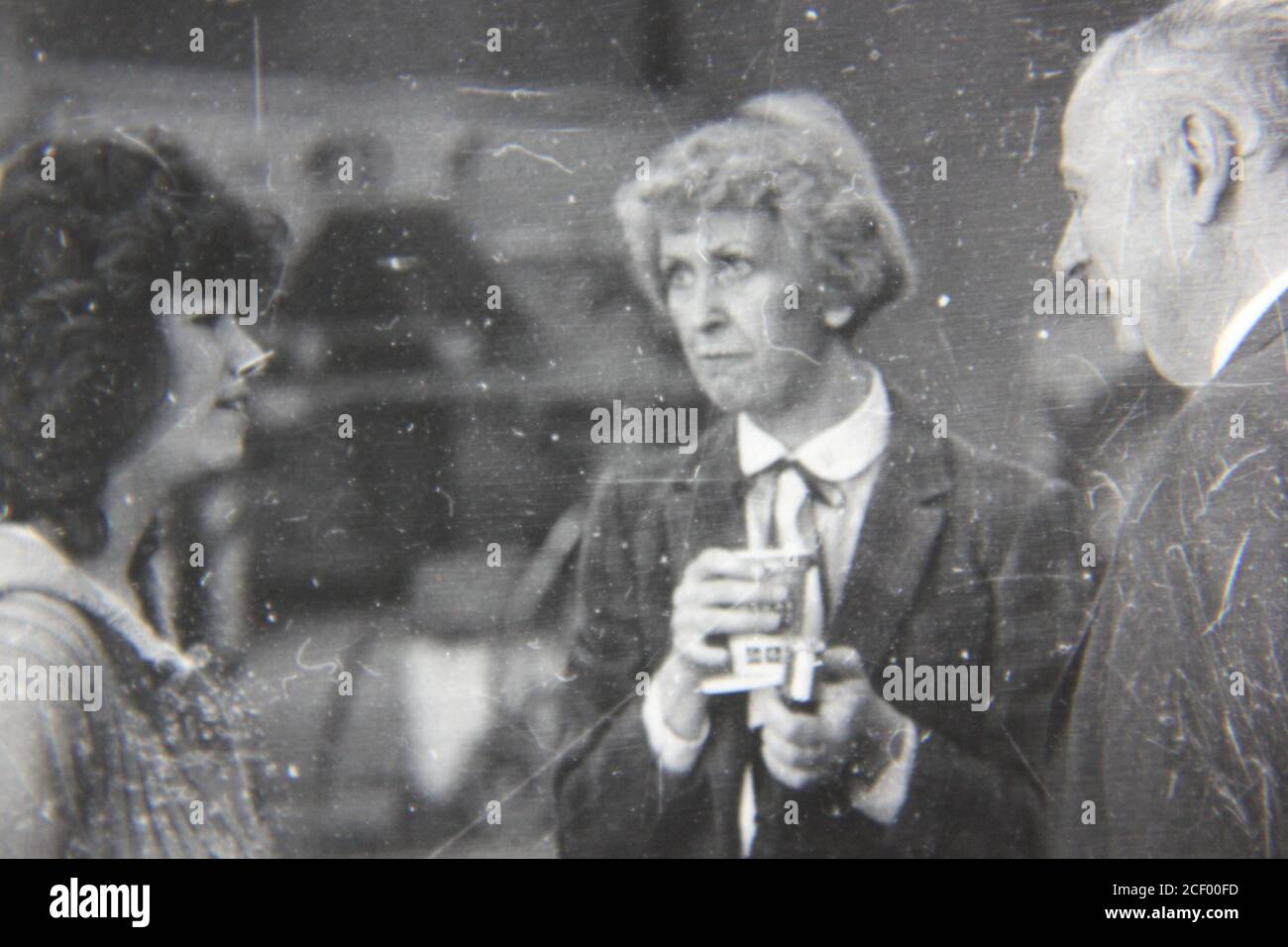 Fine 1970s vintage black and white photography of adults discussing ...