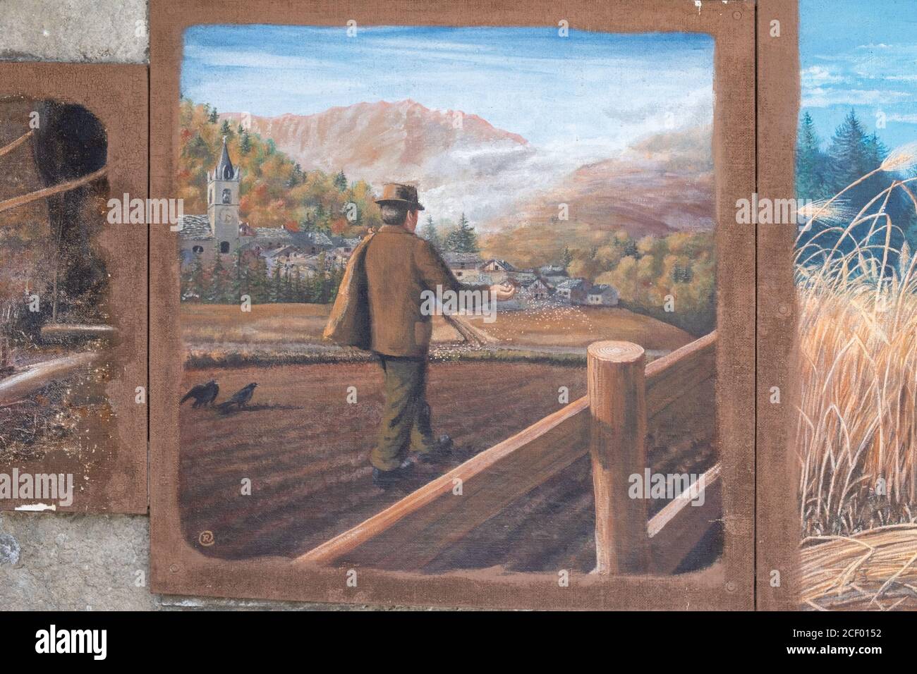 Painted murals of pre-twentieth century agricultural life in the small village of Usseaux, Piemonte,Italy Stock Photo