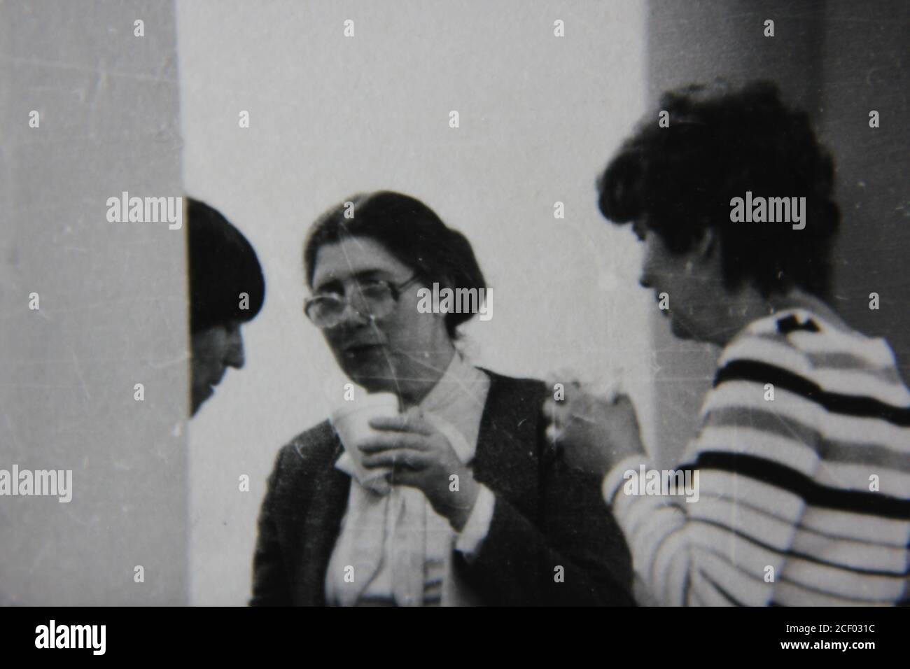 Fine 1970s vintage black and white photography of adults discussing ...