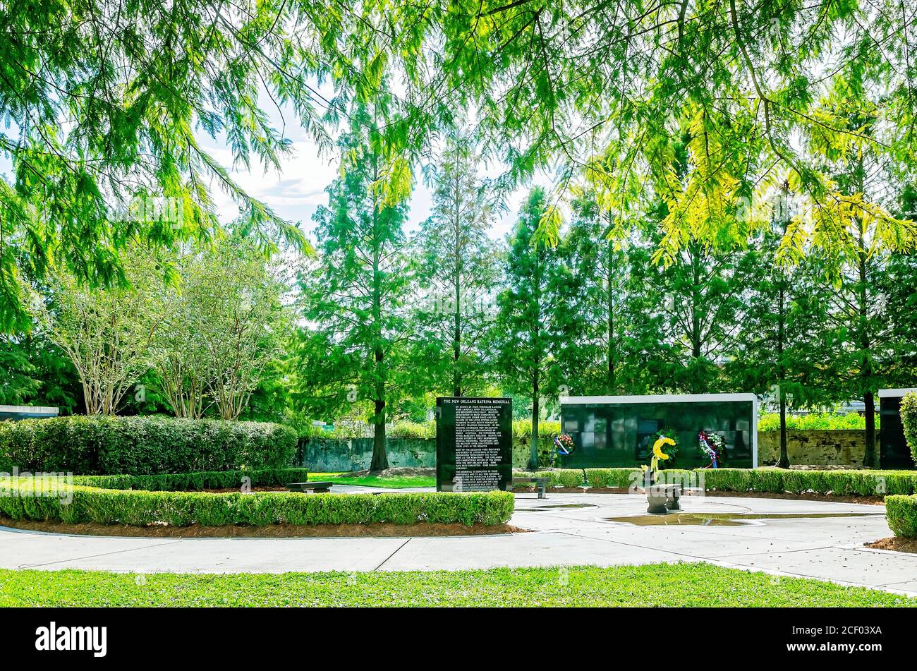 Flowers are placed in front of mausoleums for unknown hurricane victims at the Hurricane Katrina Memorial, Aug. 29, 2020, in New Orleans, Louisiana. Stock Photo