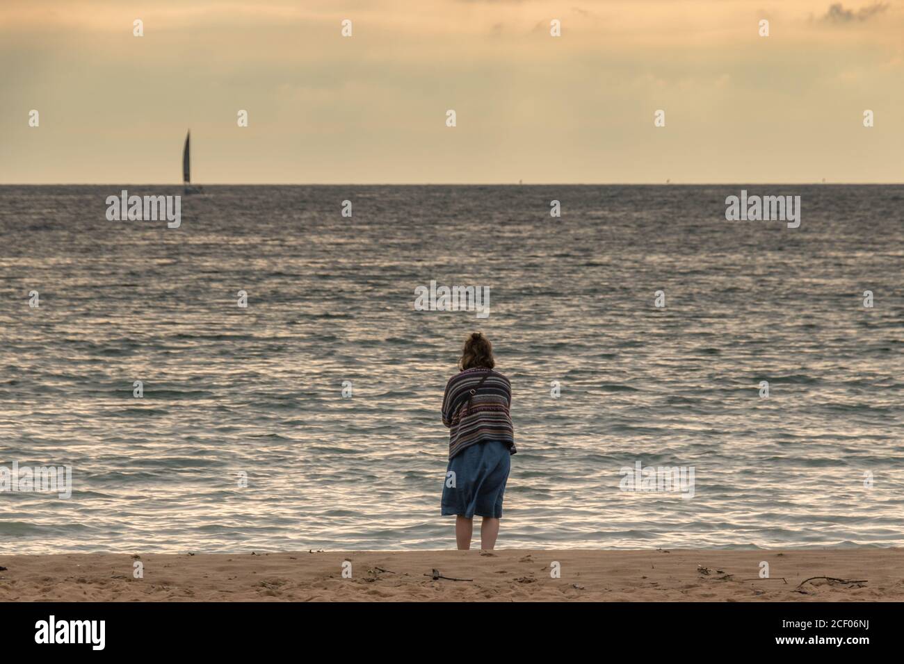 Girl stares at the sea. Plencia, Spain. Stock Photo