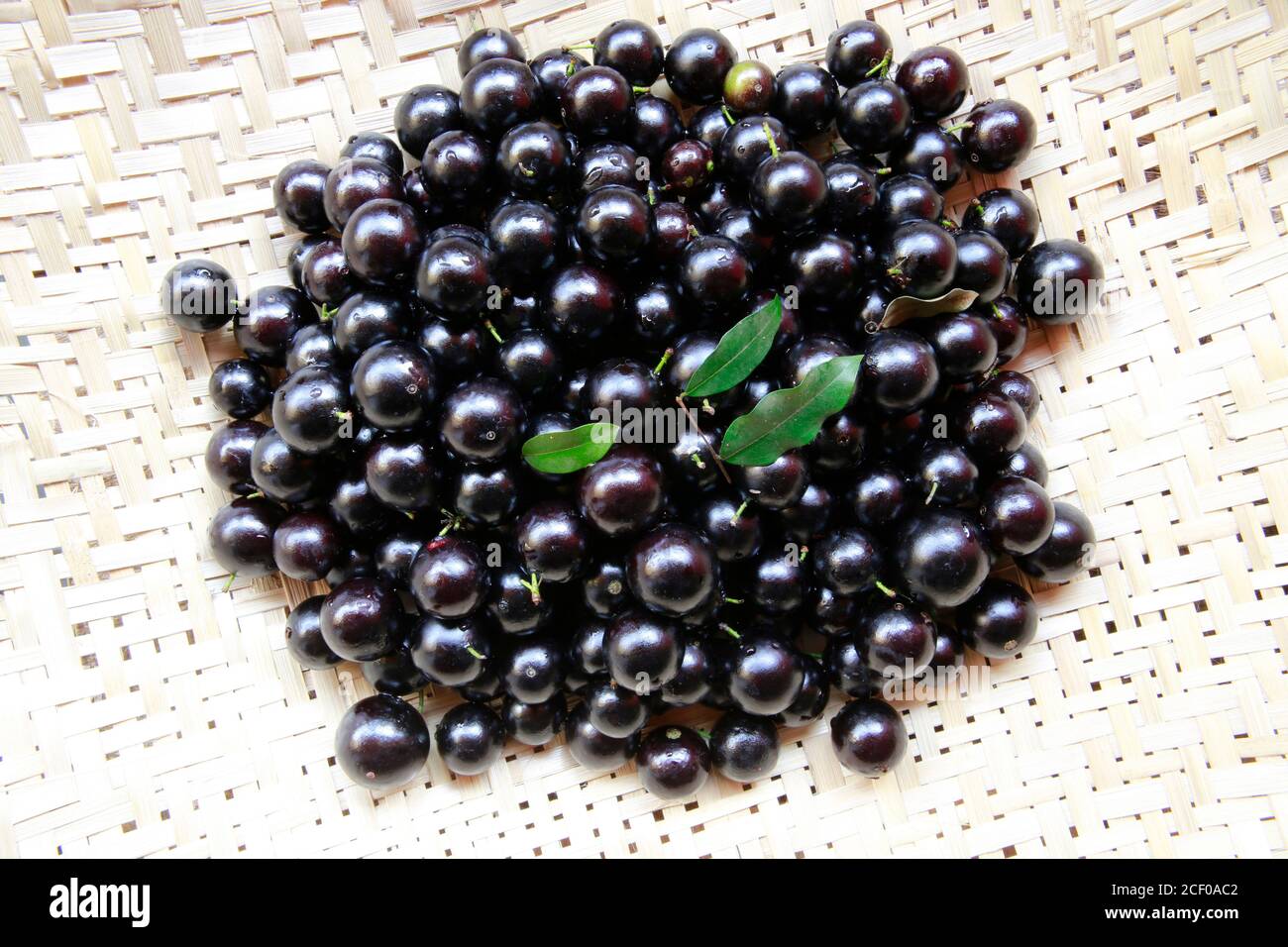 Fruit. Exotic. close up of pile of fresh jaboticaba, native Brazilian grape. Species Plinia cauliflora. Stock Photo