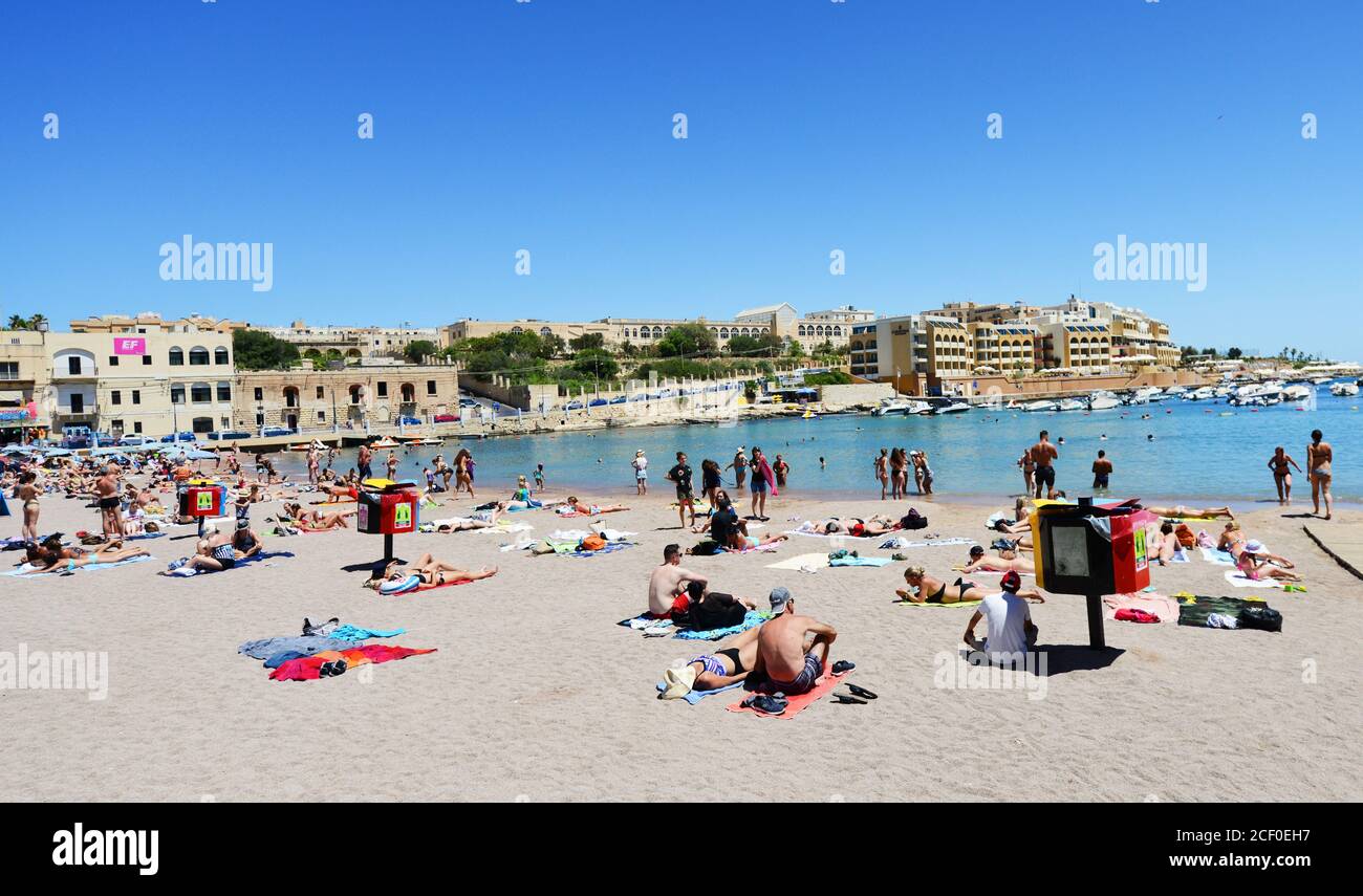 The vibrant beach of St Bay in St Julian