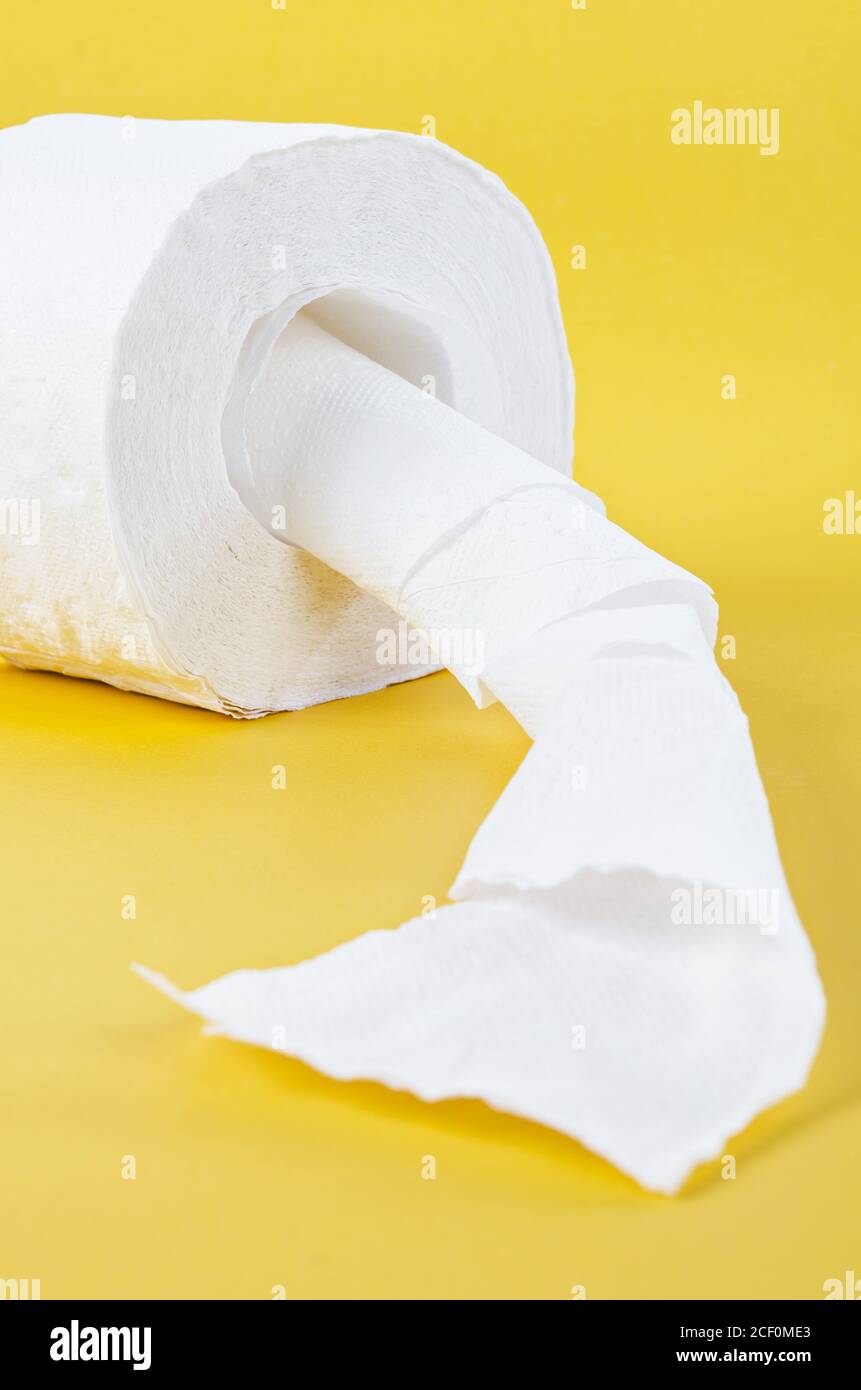Tissue paper roll on the yellow background Stock Photo Alamy