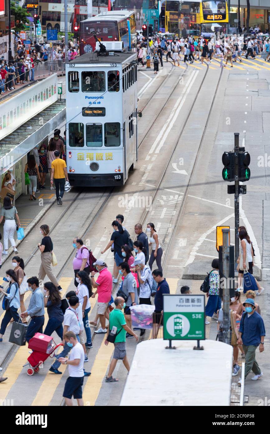 Trams and pedestrians, Causeway Bay, Hong Kong Island, Hong Kong Stock Photo