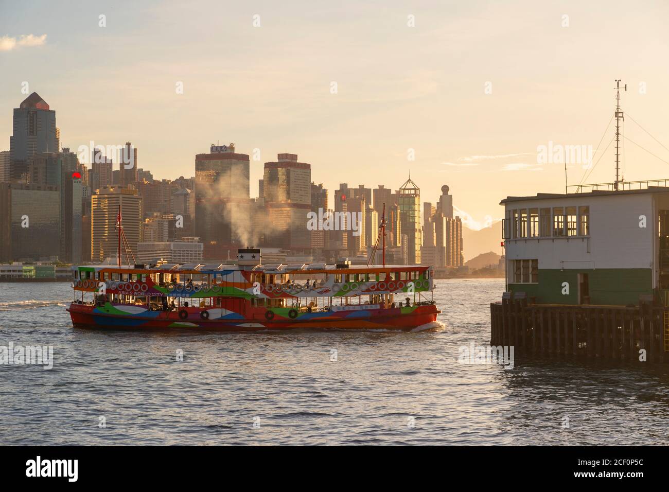 Star Ferry and Star Ferry Pier, Tsim Sha Tsui, Kowloon, Hong Kong Stock Photo