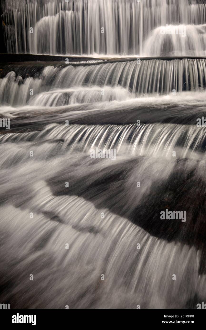 Moody long-exposure water blurs at Grogan Creek Falls - Butter Gap Trail, Pisgah National Forest, near Brevard, North Carolina, USA Stock Photo
