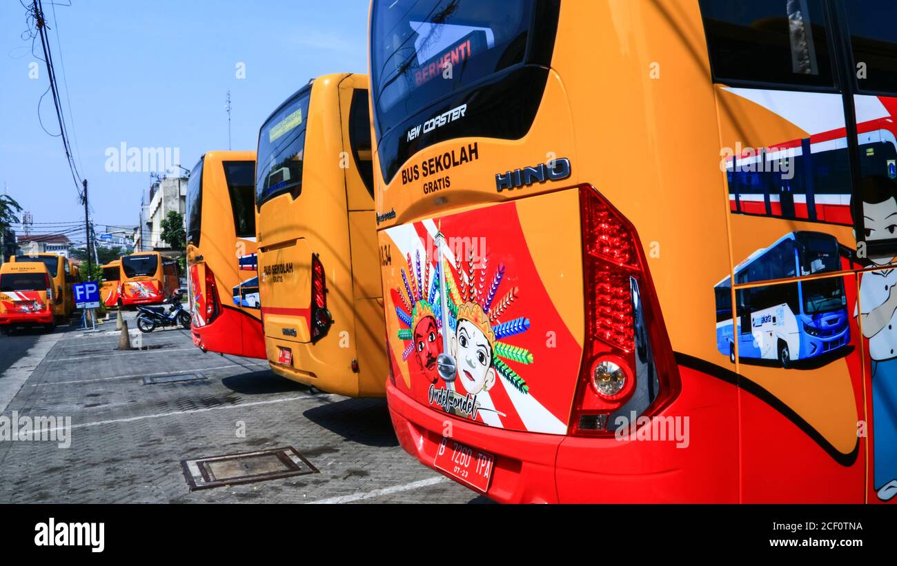 Jakarta, Indonesia - July 16, 2019:  Free school bus parking on Jalan Cengkeh, West Jakarta. Stock Photo