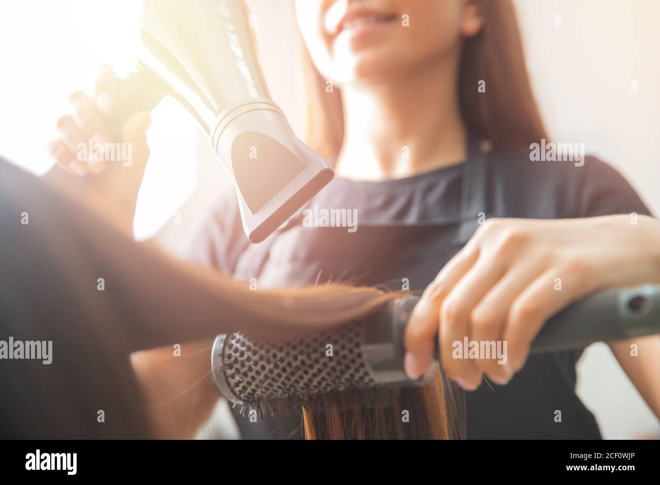 Female hairdresser dryer brush hi-res stock photography and images - Alamy
