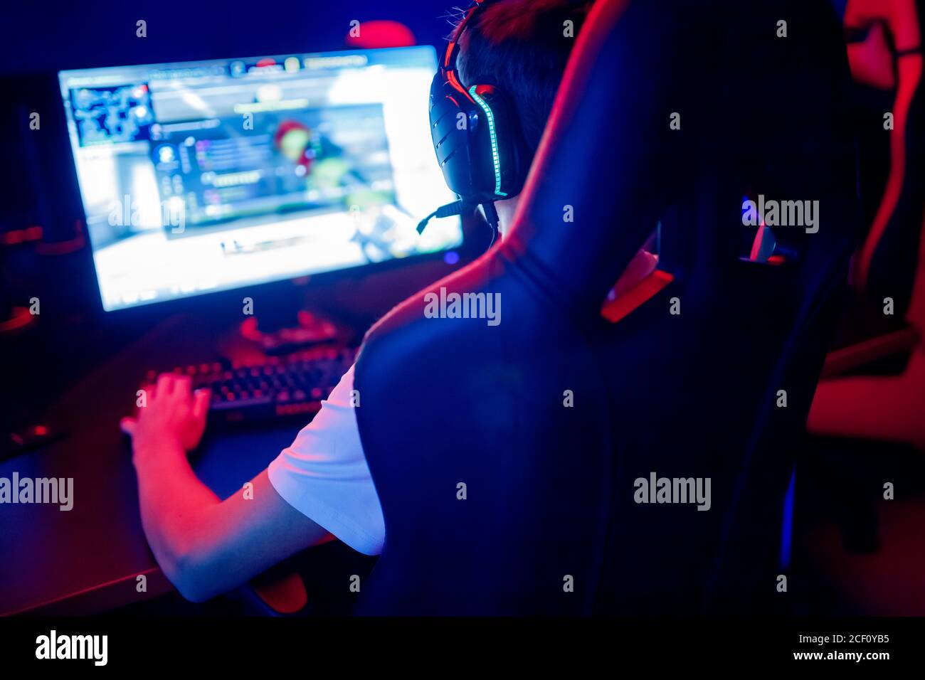 Professional gamer playing online games tournaments pc computer with