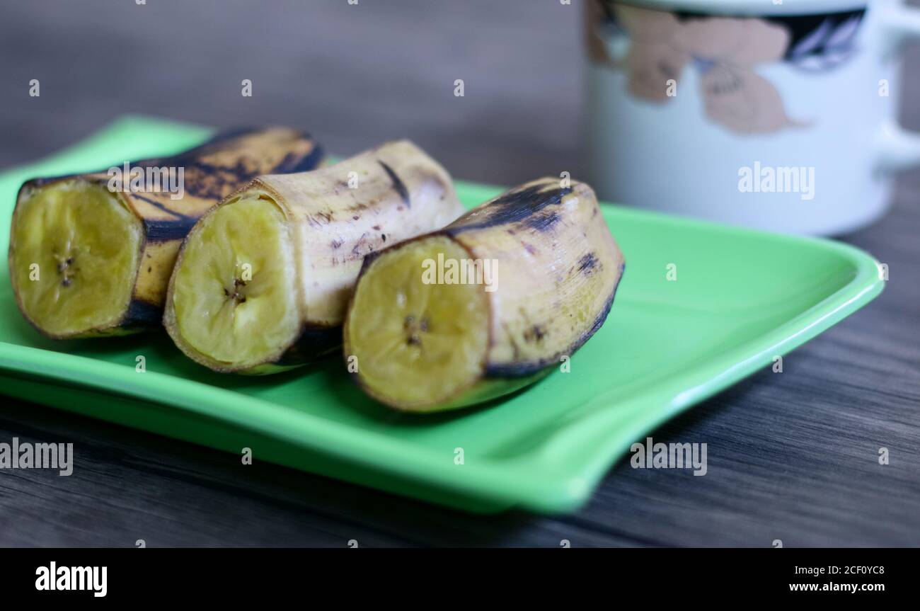 Boiled banana on wood background. Stock Photo